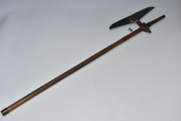 AN INDIAN BULLOVA AXE with a leaf shaped axe head, a tiered finial at the haft junction with an