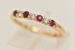 AN 18CT GOLD RUBY AND DIAMOND HALF ETERNITY RING, set with three small round brilliant cut