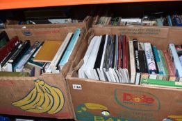 FOUR BOXES OF BOOKS containing a large number of miscellaneous titles in hardback and paperback