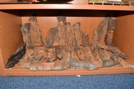 A LARGE COLLECTION OF POLISH FOLK CARVED FACES comprising approximately thirty five faces of