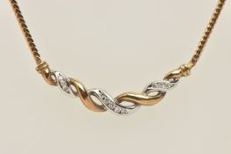 AN 9CT GOLD DIAMOND NECKLACE, a bi colour twist design pendant, channel set with eleven round