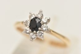 A 9CT GOLD GEM SET CLUSTER RING, designed as a principally set oval cut sapphire, prong set with a
