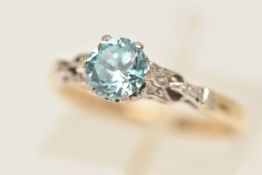 A BI COLOUR GEM SET RING, a single circular cut blue zircon, prong set in white metal with withe