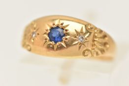 AN EARLY 20TH CENTURY 18CT GOLD RING, a yellow gold tapered and domed band ring, star set with a
