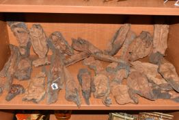 A LARGE COLLECTION OF POLISH FOLK CARVED FACES comprising approximately thirty faces of assorted