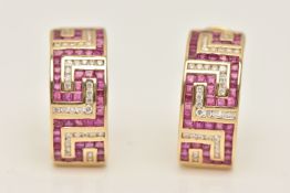 A PAIR OF YELLOW METAL GEM SET EARRINGS, each earring designed as half a hoop Greek key pattern