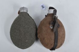TWO GERMAN WWII ERA WATER BOTTLES, in cloth covers belt attachments , one lid is marked HWSD 40