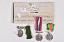 A WORLD WAR TWO GROUP OF MEDALS, to include Defence & War Medal together with a Geo VI Territorial