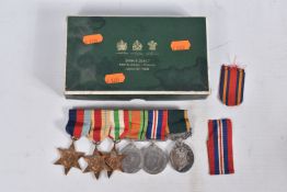A SWING MOUNTED GROUP OF MEDALS IN A SPINK & SON BOX, the medals are a Territorial Efficiency