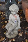 A SMALL CONCRETE GARDEN FIGURE OF A SEATED BOY, height 50cm, condition report: weathered finish