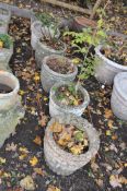 SIX VARIOUS WEATHERED CONCRETE CIRCULAR PLANTERS, to include a pair of decorated planters,