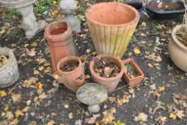 FIVE TERRACOTTA GARDEN ITEMS, to include a tall tapered reeded vase, , diameter 48cm x height