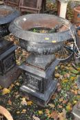AN EARLY 20th CENTURY CAST IRON CAMPAGNA GARDEN URN ON STAND with balustered bowl and foliate detail