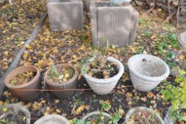 A PAIR OF TERRACOTTA PLANTERS, 40cm diameter x height 31cm, and a pair of concrete planters,