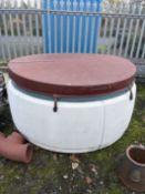 A HOTSPOT HOT TUB, with lid, chemical and workings inside, 180cm in diameter 100cm high (