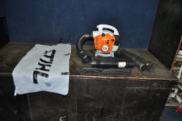 A STIHL SH56C PETROL LEAF BLOWER with collection bag, strap and pipework (APPEARS TO BE BRAND NEW