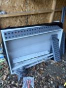 A PRESSED STEEL PARTS WASHER, with loose grills, and detachable legs, 136cm x 96cm