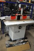 AN AXMINSTER TRADE AT220SM INDUSTRIAL SPINDLE MOULDER with a 180cm x 56cm cast iron table, an