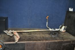 A STIHL FS55 PETROL STRIMMER with handles and fitted with metal blade, Condition report: engine