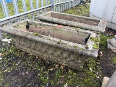 A PAIR OF WEATHERED CONCRETE RECTANGULAR PLANTERS, with a lattice design to the side, length 88cn