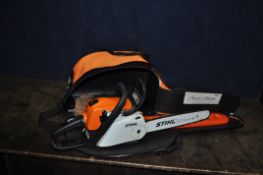 A STIHL MS211/C PETROL CHAINSAW IN STIHL BAG with 14in cut and blade guard, condition report: engine