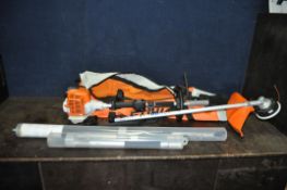 A STIHL KM94RC COMBI ENGINE with a F5KM strimmer attachment, a 1mtr, a 75cm, a 50cm extension