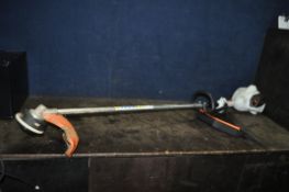 A STIHL FS56RC PETROL STRIMMER with handle and strap, condition report: engine pulls freely but
