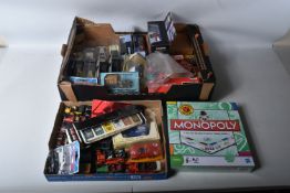 AN ASSORTMENT OF BOXED AND LOOSE DIECAST MODELS, GAMES AND PLAYING CARDS, the loose models include a