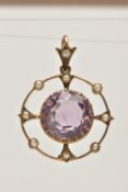 A YELLOW METAL AMETHYST AND SEED PEARL NECKLACE, of an open work circular form, set with a central