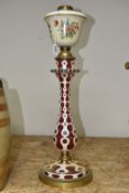 A BOHEMIAN CRANBERRY AND WHITE OVERLAY GLASS LAMP BASE of cranberry glass with a white opaque