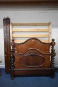 A VICTORIAN MAHOGANY 4FT6 BEDSTEAD, with barley twist uprights, bulky wooden side rails and pine