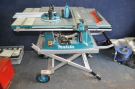 A MAKITA MLT100 TABLE SAW with wheeled folding frame, mitre and parallel guides, sliding table
