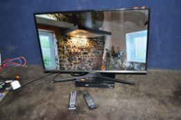 A SAMSUNG UE32J5100 32in TV with remote and a Philips Blu-Ray player with remote (both PAT pass