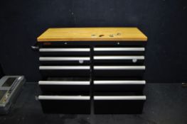 A CSPS MECHANIC TOOLCHEST with two banks of five graduated metal drawers, a beech butchers block