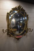 A 18TH CENTURY ROCOCO-STYLE GILT GESSO GIRANDOLE MIRROR, with ornate foliate details and swags,