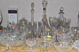 A COLLECTION OF CRYSTAL CUT GLASS to include a Royal Doulton decanter with a strapped pattern, a