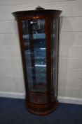 A MODERN HUANGHUALI DEMI-LUNE DISPLAY CABINET, the bevelled glass door enclosing a mirror back and