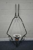 A WROUGHT IRON FULL HARP RAILWAY LIGHT FITTING, with scrolled details, with a copper and green