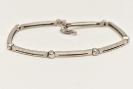 A CONTEMPORARY 9CT GOLD LINE BRACELET, white gold bracelet, set with four round brilliant cut