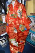A TRADITIONAL JAPANESE WEDDING KIMONO ROBE, featuring vibrant coloured embroidered flower panels, on