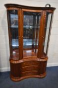 A MODERN ORIENTAL STYLE HUANGHUALI KIDNEY DISPLAY CABINET, the three bevelled glass doors