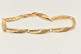 AN YELLOW METAL LINE BRACELET, a yellow metal line bracelet with matt and polished finish, set