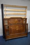 AN EDWARDIAN MAHOGANY AND MARQUETRY INLAID 4FT6 BEDSTEAD, with a pair of irons and pine slatted