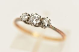 A YELLOW METAL DIAMOND THREE STONE RING, claw set with three old cut diamonds, estimated total