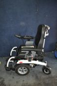 AN EXCEL AIRIDE ELECTRIC WHEELCHAIR with heavy duty frame, indicators and lights and two chargers,
