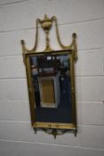 A MODERN GILT WOOD RECTANGULAR WALL MIRROR, with metal swags, width 51cm x height 118cm, condition