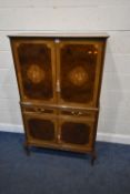 A REPRODUCTION FRENCH WALNUT COCKTAIL / DRINKS CABINET, the top double cupboard doors enclosing a