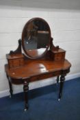 A VICTORIAN MAHOGANY DRESSING TABLE, with an oval swing mirror and an arrangement of five drawers,
