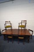 A MAHOGANY RECTANGULAR WIND OUT DINING TABLE, with one additional leaf, raised on octagonal legs,