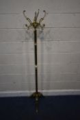 A BRASS COAT / HAT STAND, with four branches, a Corinthian style pillar with an onyx sphere,